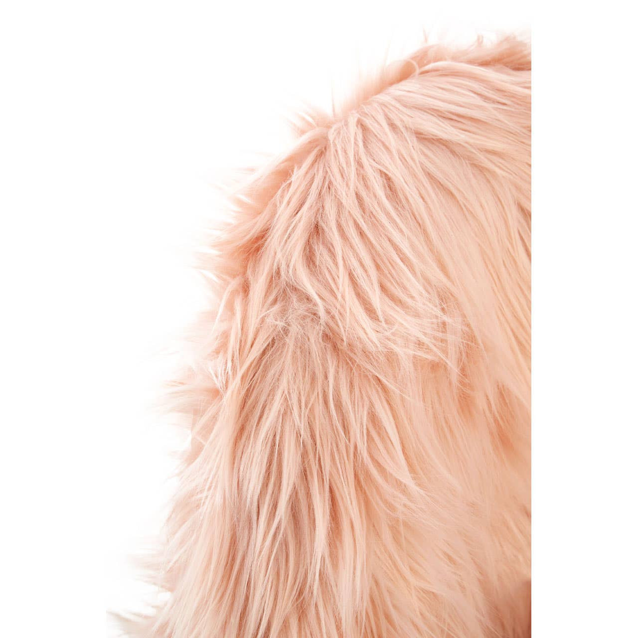 Soft pink faux fur texture of a kids chair, showcasing fluffy fibers that create a cozy and inviting appearance. The chair's design is perfect for a child's room, emphasizing comfort and style