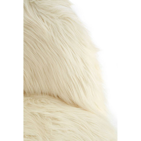 Soft white faux fur texture of a kids' chair, showcasing a cozy and plush appearance. The chair features a rounded back and is designed for small children, emphasizing comfort and style