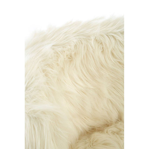 Close-up view of soft, fluffy white faux fur, showcasing the texture and plushness of the material used in a kids' chair