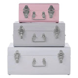 Set of three pastel metal storage trunks with silver latches in pink, grey and white