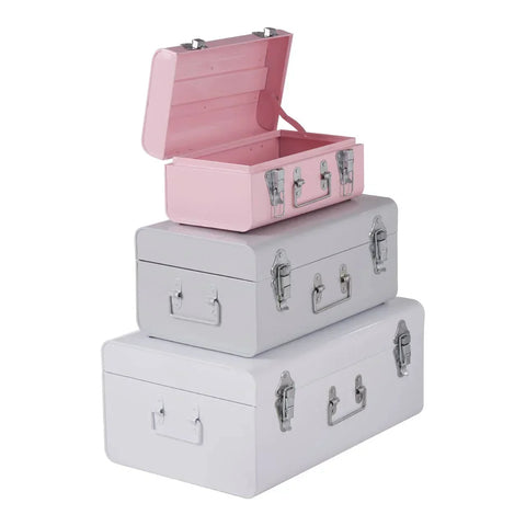 Set of three metal storage trunks in pastel pink and grey with chrome latches, stacked