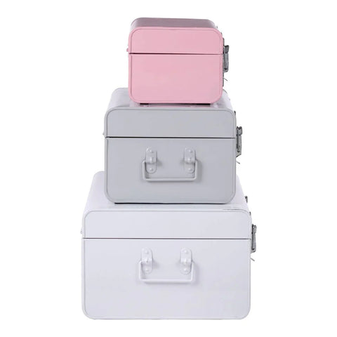 Set of three metal storage trunks in pink, grey, and white stacked vertically