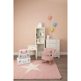 Kids bedroom furniture set with white drawers, bookcase, pink armchair and star rug
