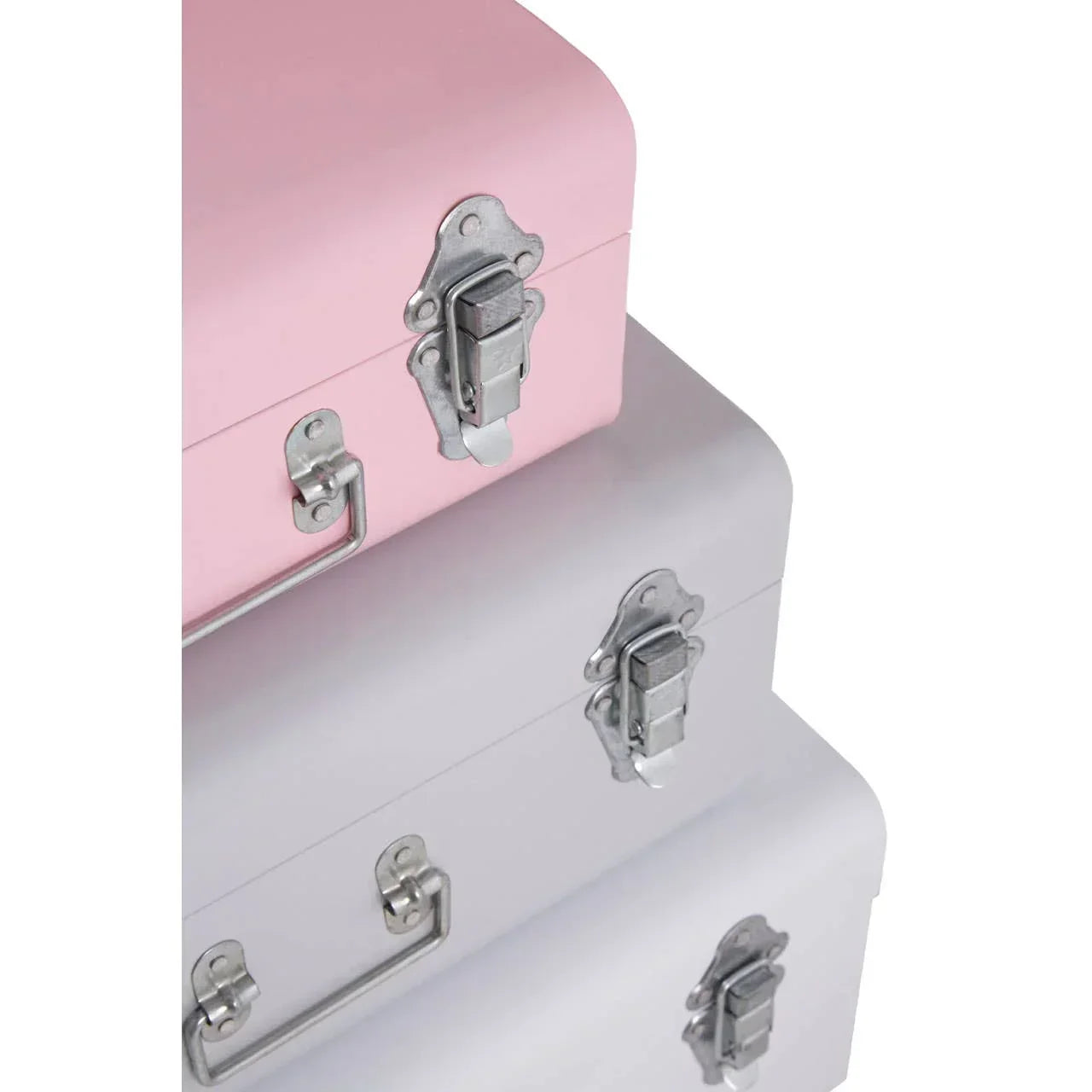 Stacked pink and grey metal storage trunks with silver latches and handles