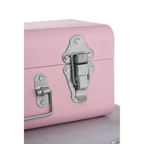Pink metal storage trunk with silver latch and handle detail, close-up view