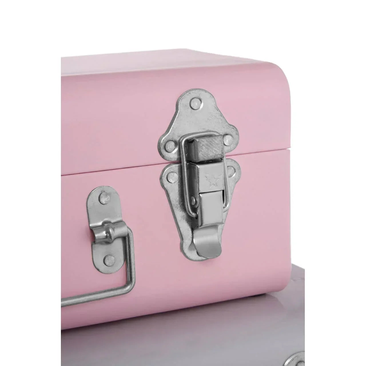 Pink metal storage trunk with silver latch and handle detail, close-up view