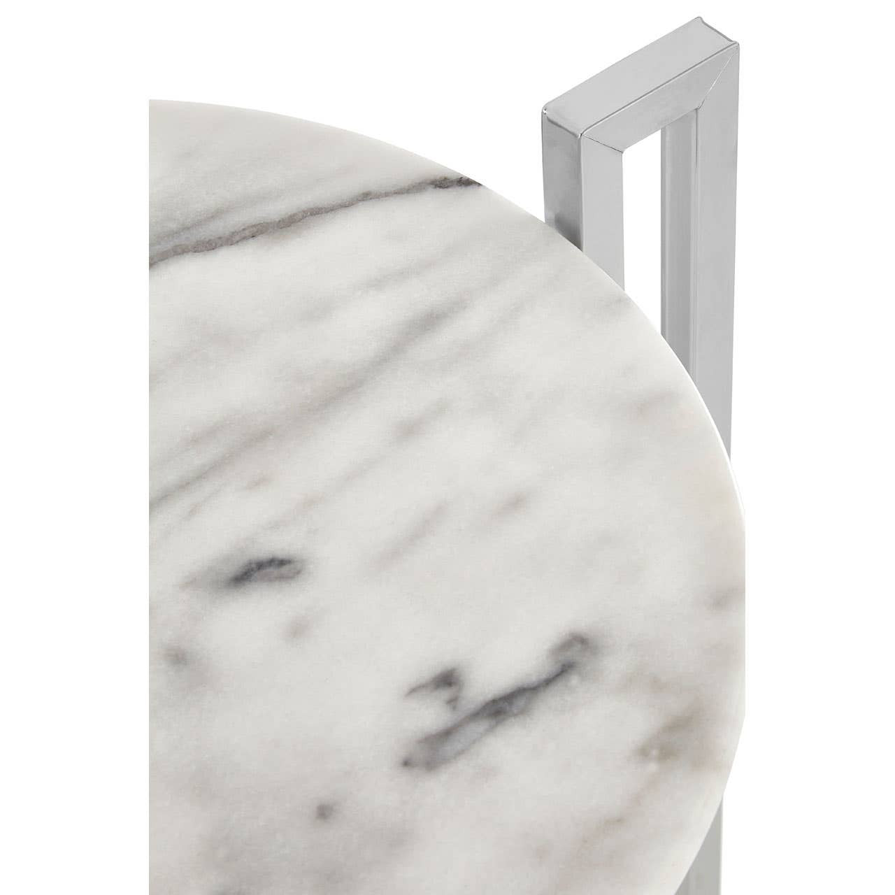Round white marble tabletop featuring subtle gray veining, paired with a sleek chrome base that has a modern geometric design. The table is shown from a top-down angle, highlighting the smooth surface and polished finish of the marble