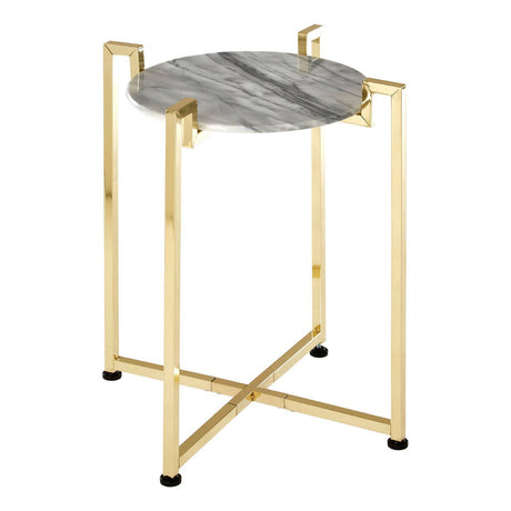 White marble side table with a round top featuring subtle gray veining, supported by a warm gold metal base with a modern geometric design and four legs. The table has a sleek, polished finish and small black feet for stability