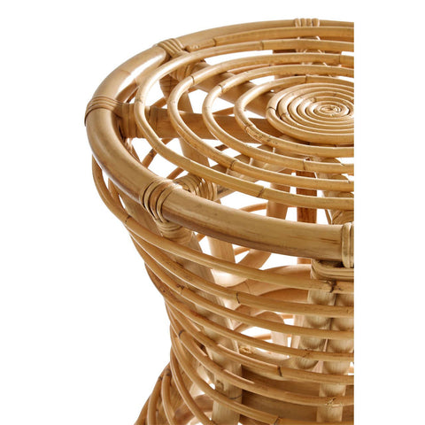 Natural rattan stool featuring a circular top with a woven pattern and a tapered base, showcasing the light brown color and texture of the rattan material
