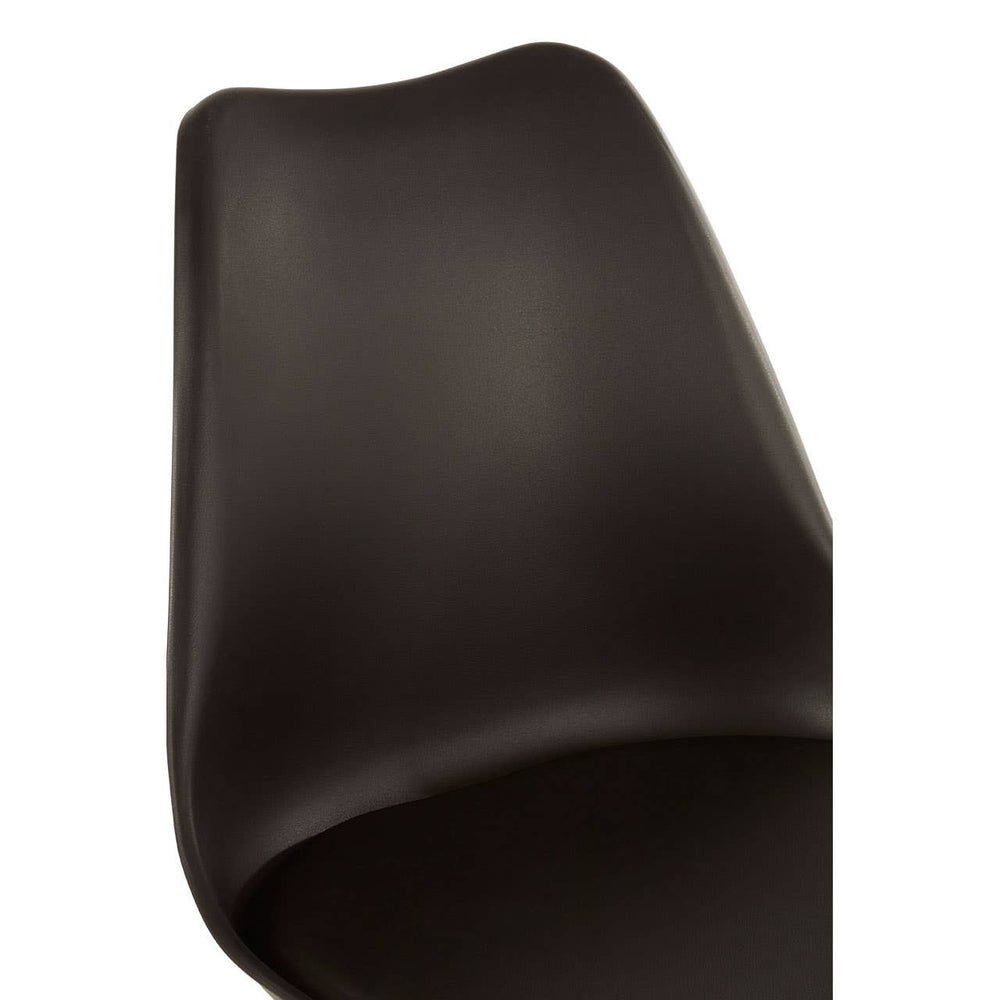 Black padded seat dining chair with a sleek, curved backrest and a modern design, showcasing a smooth surface and minimalistic style