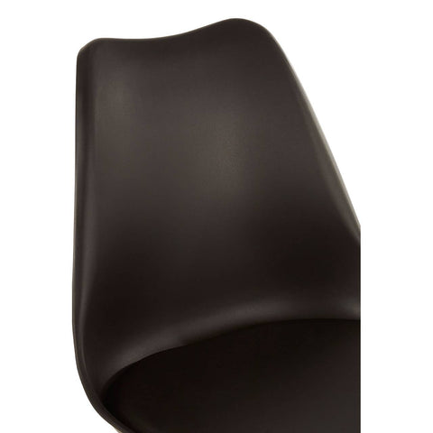 Black padded seat dining chair with a sleek, curved backrest and a modern design, showcasing a smooth surface and minimalistic style
