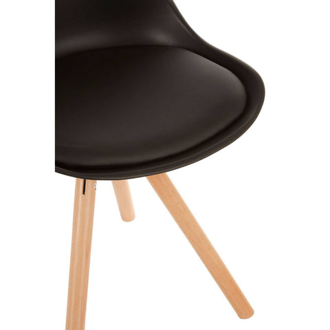 Black padded seat dining chair with a smooth, curved design and light wooden legs, showcasing a modern aesthetic suitable for dining spaces