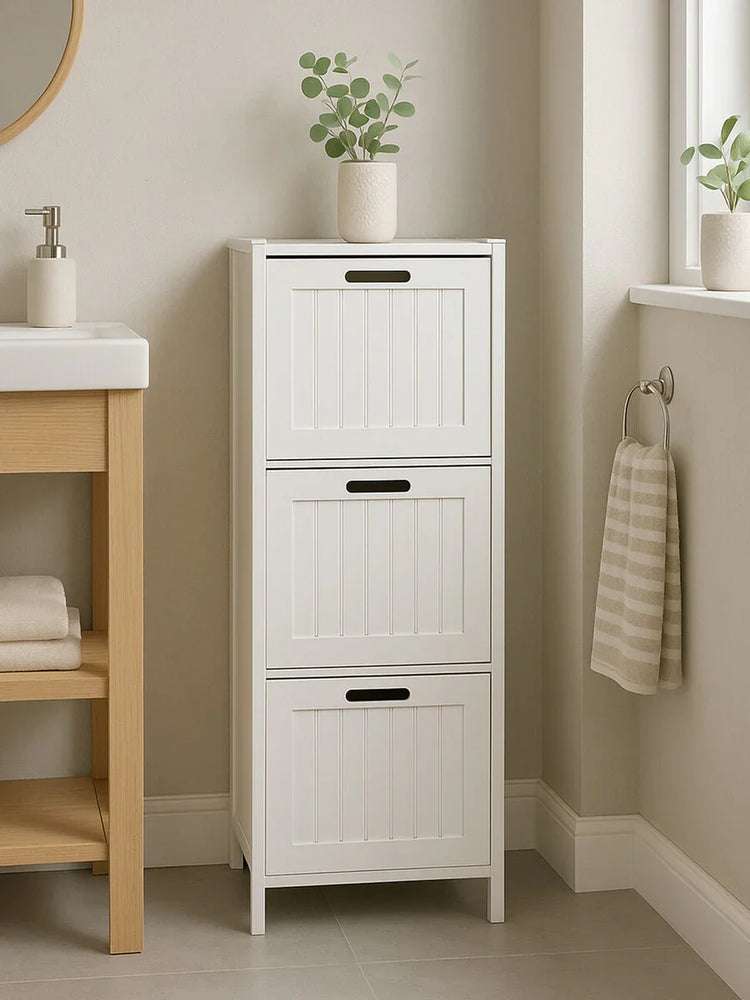 White bathroom storage cabinet with three doors and vertical panel design, potted plant on top