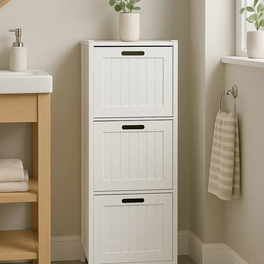 White bathroom storage cabinet with three doors and vertical panel design, potted plant on top