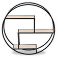 Three-tier round metal wall shelf featuring a circular black frame with three wooden shelves arranged in a modern, geometric design. The shelves are light-colored, providing a contrast to the dark frame