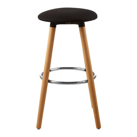 Black round bar stool with a smooth, curved seat and four wooden legs. The legs are light-colored with a natural finish, and there is a chrome footrest connecting two of the legs for added support