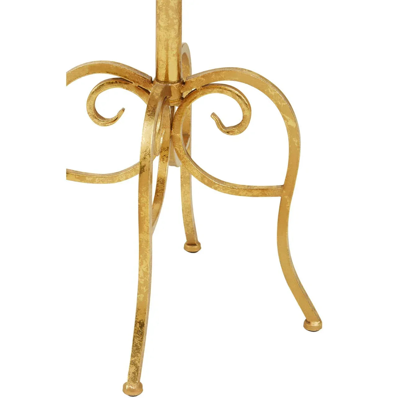 Gold metal table base with curved and scrolled legs, closeup of furniture detailing