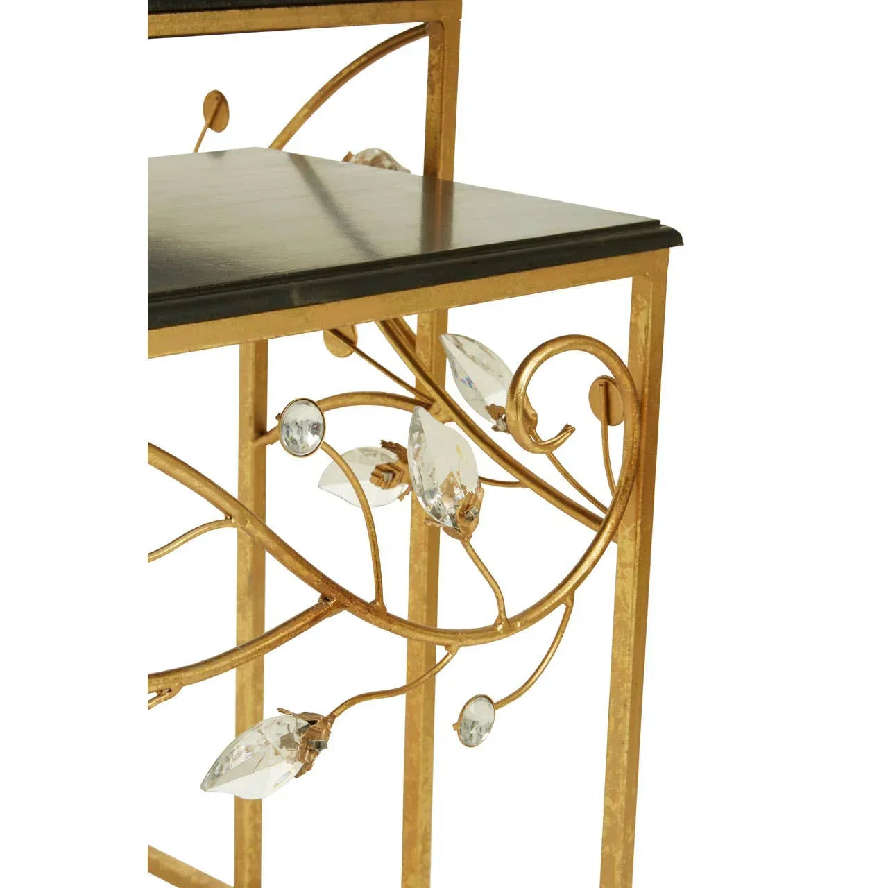 Gold metal side table with glass accents and black tabletop, ornate floral design detail