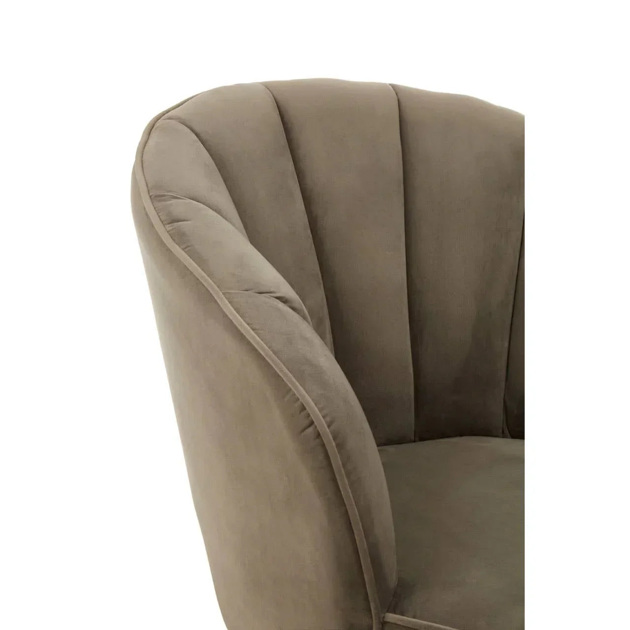 Close-up of taupe velvet armchair with scalloped backrest detail