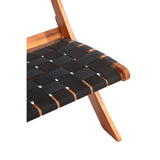 Black woven chair featuring a sleek design with a woven seat and wooden frame. The chair has a minimalist aesthetic, showcasing a combination of black fabric and natural wood tones. The structure includes angled legs for stability and style