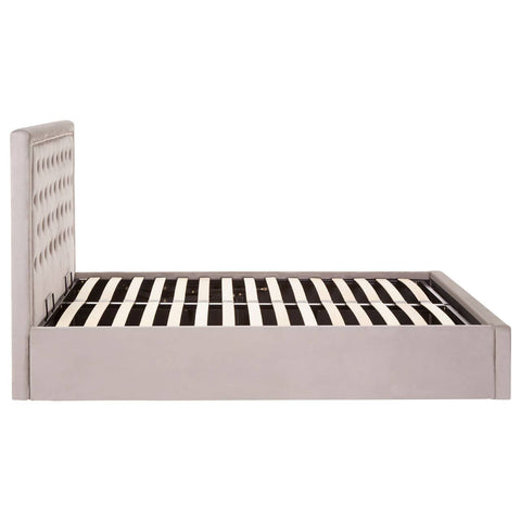 Grey velvet ottoman bed with a double size frame, featuring a slatted base for mattress support and a tall, textured headboard. The overall design is modern and elegant, suitable for various bedroom styles