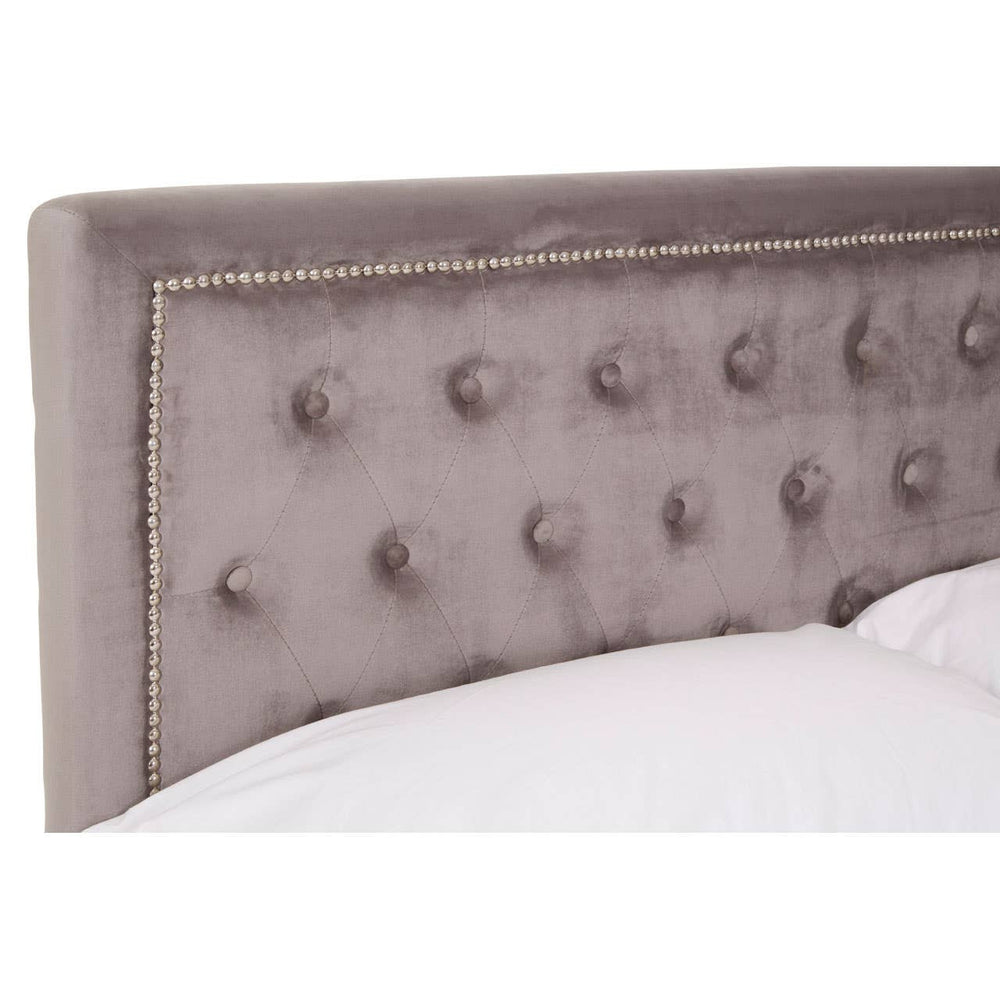 Grey velvet headboard with tufted detailing and decorative trim, designed for a double ottoman bed. The fabric has a soft sheen, enhancing the elegant look of the furniture piece