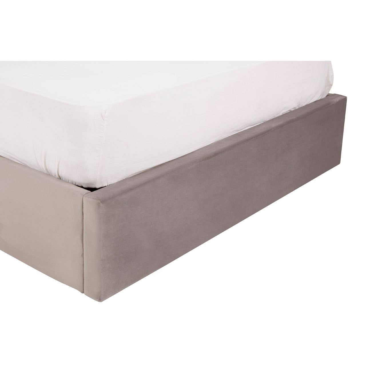 Grey velvet ottoman bed with a plush mattress on top and a sleek, upholstered base, showcasing a modern and elegant design suitable for a double bedroom