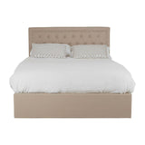 Beige upholstered double bed with a tufted headboard, featuring a white duvet and two matching pillows, designed with an ottoman storage base