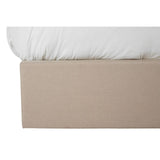Beige ottoman double bed with a soft, white mattress top partially visible, showcasing a clean and modern design. The base is upholstered in a light beige fabric, providing a neutral and versatile look suitable for various bedroom styles