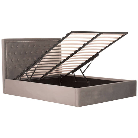 Grey upholstered king bed with a tufted headboard and a lift-up storage feature, showcasing a spacious interior for storage. The bed frame has a modern design with clean lines and a neutral color that complements various decor styles
