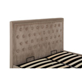 Mink velvet upholstered headboard with tufted detailing and two handles, paired with a slatted bed base featuring black and beige stripes