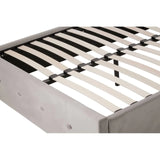 Upholstered bed frame with wooden slats and tufted side panel, corner angle view