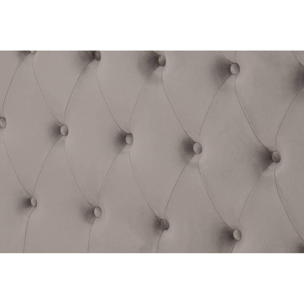 Grey upholstered headboard with deep button tufting and diamond stitch detail