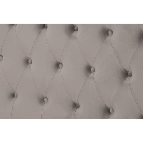 Grey upholstered headboard with deep button tufting and diamond stitch detail