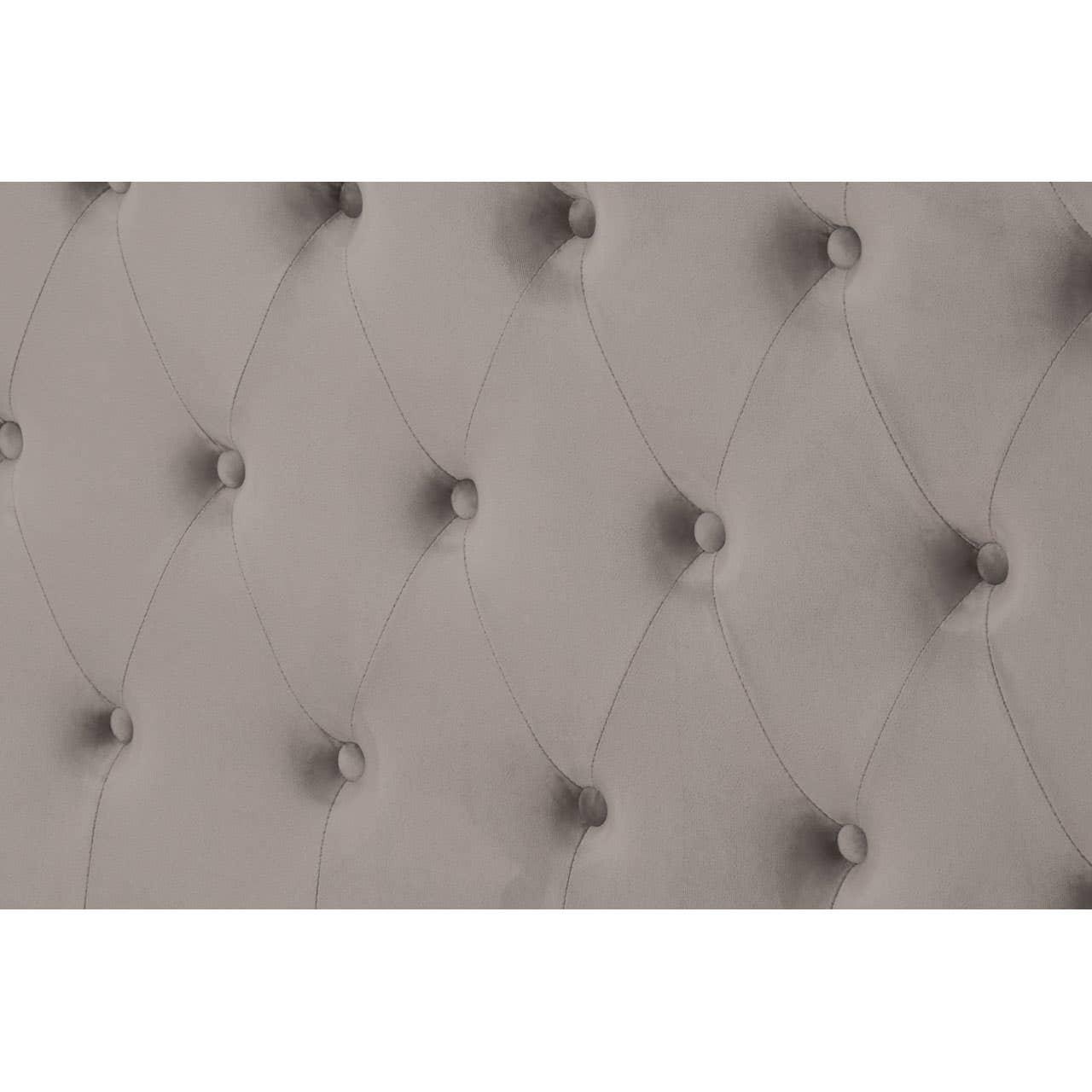 Grey upholstered headboard with deep button tufting and diamond stitch detail