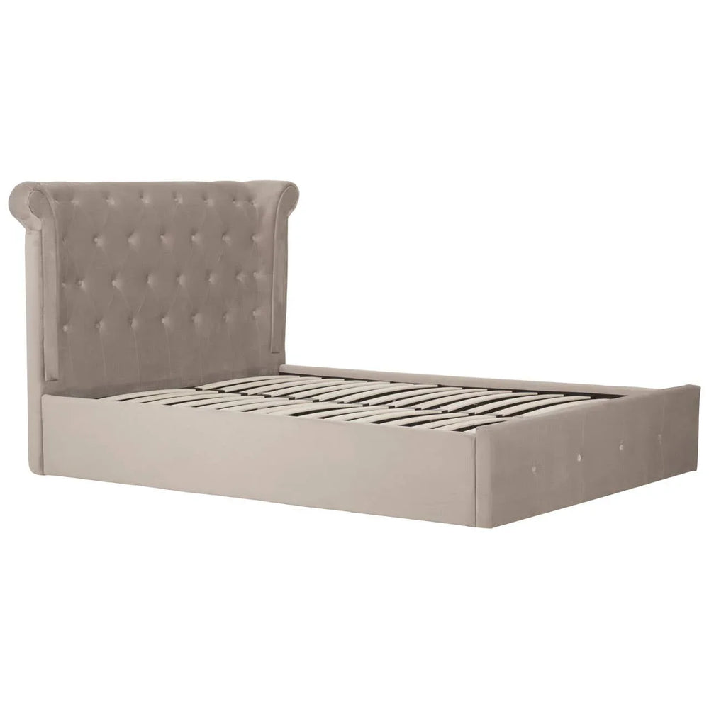 Beige velvet bed frame with tufted headboard and wooden slats, side angle view