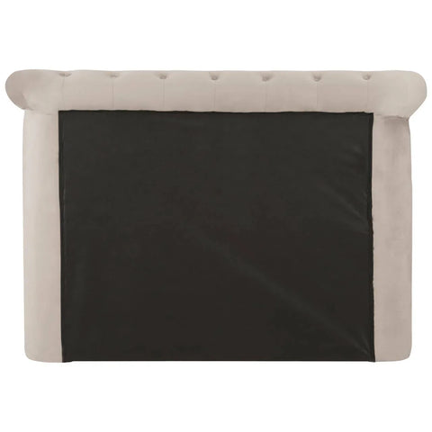 Rear view of beige upholstered bed headboard with tufted velvet detail