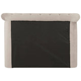 Rear view of beige upholstered bed headboard with tufted velvet detail