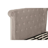 Tufted velvet bed frame headboard in light beige with diamond button detail, side angle view