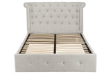 Grey upholstered bed frame with button tufted headboard and wooden slats, front view