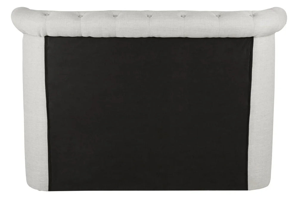 Back view of tufted fabric sofa with light upholstery and black panel detail