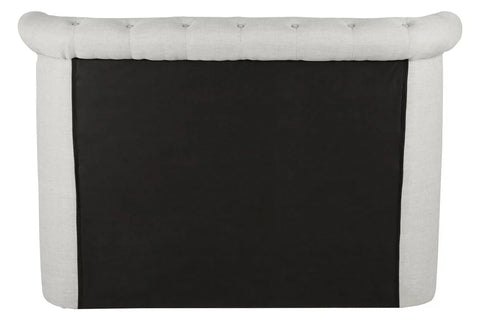 Back view of tufted fabric sofa with light upholstery and black panel detail