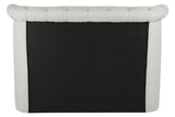 Back view of tufted fabric sofa with light upholstery and black panel detail
