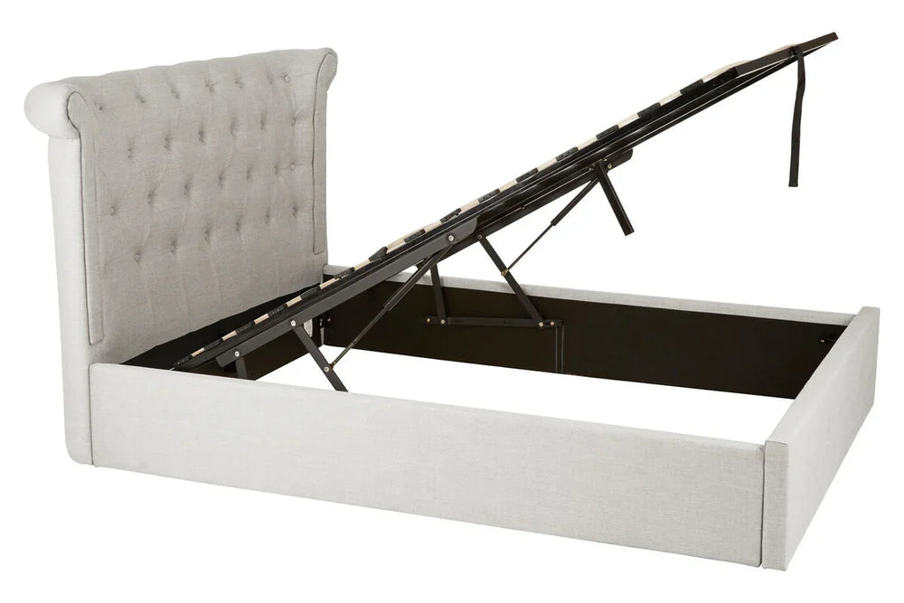 Light grey ottoman bed frame with tufted headboard and lift-up storage base
