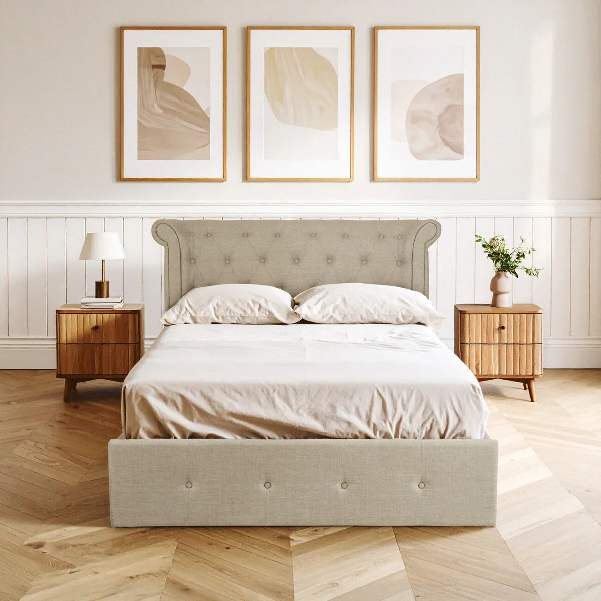 Beige upholstered bed frame with buttoned headboard and two wooden bedside tables