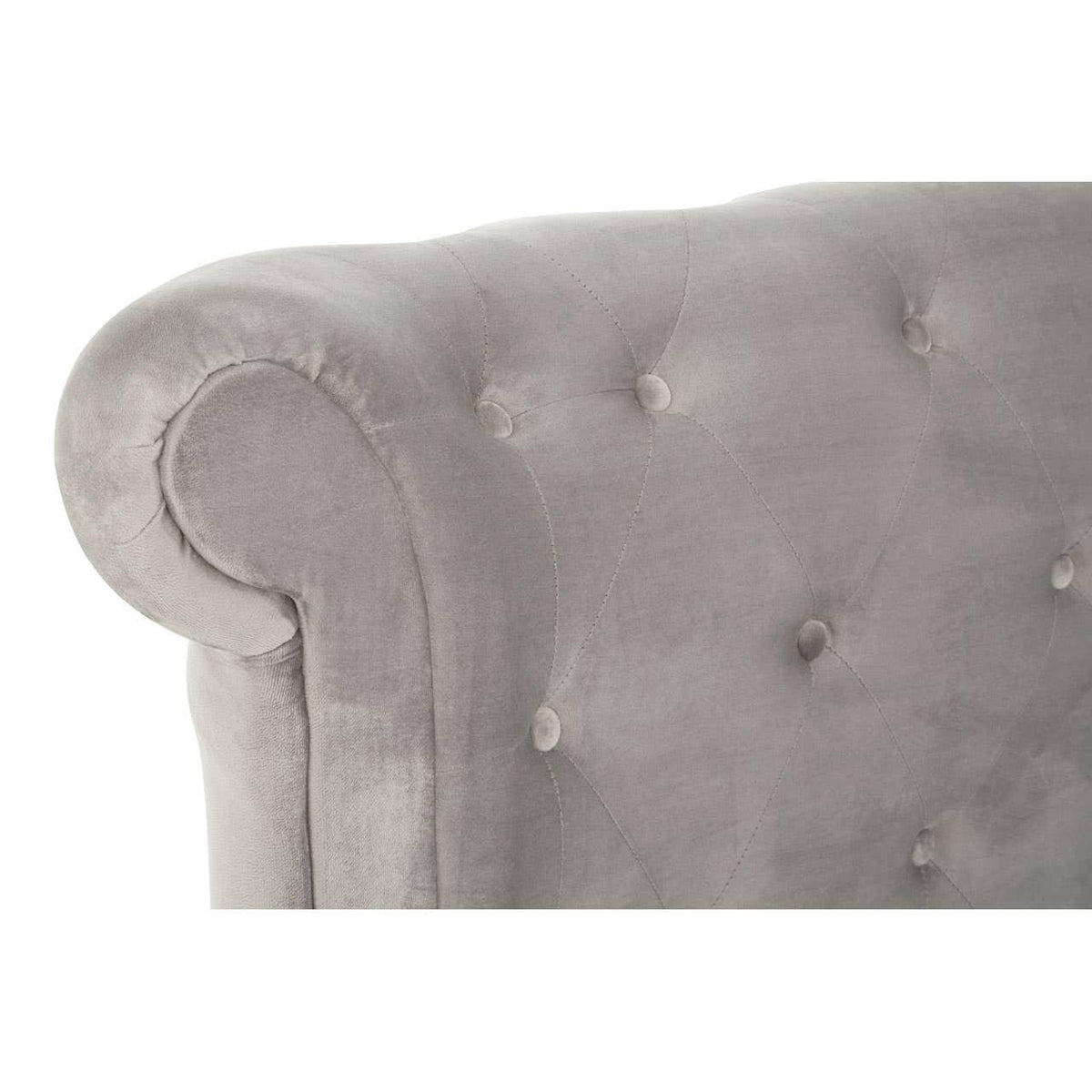 Grey velvet sofa armrest with button-tufted upholstery, close up on rolled detail