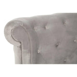 Grey velvet sofa armrest with button-tufted upholstery, close up on rolled detail