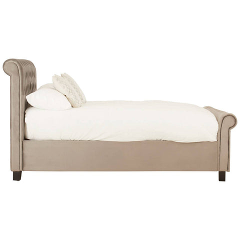 Grey ottoman double bed featuring a sleek design with a low backrest and rolled arms, complemented by a plush white mattress and decorative pillows. The bed is supported by dark wooden legs, enhancing its modern aesthetic