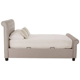 Light grey ottoman double bed with a tufted headboard, featuring a spacious mattress and two decorative cushions. The bed has a sleek design with wooden legs and a storage compartment underneath