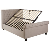 Light grey ottoman double bed with a tufted headboard, featuring a slatted base that is partially lifted to reveal storage space underneath. The bed has rounded edges and sits on small black legs